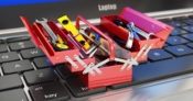 Open toolbox on top of a laptop keyboard