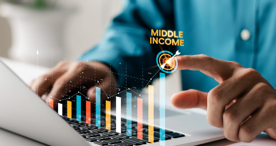 Image of hands typing at a keyboard with an overlay of a bar graph showing "Middle Income".