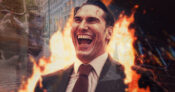 Image of devilsh-looking man in suit standing before an office building with flames behind him.