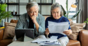 Image of an older couple reviewing documents.