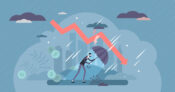 Image showing figure in storm with umbrella, under a fever graph point downward. Recession fears grow as economic growth slows.