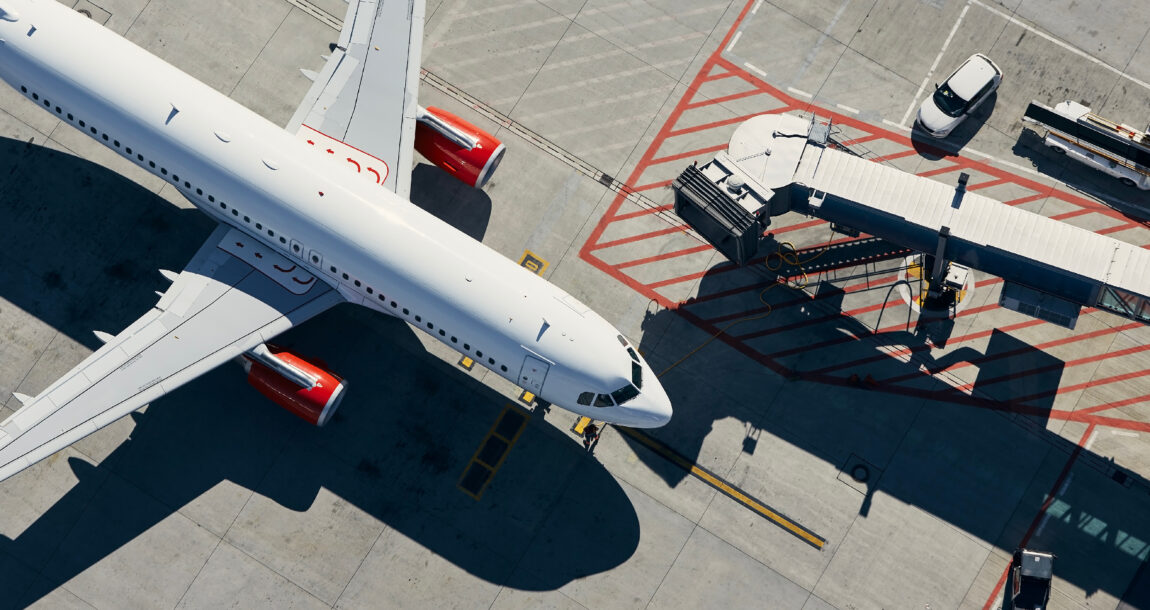 Image of jet on the tarmac. Biden plan won't do away with need for travel insurance.