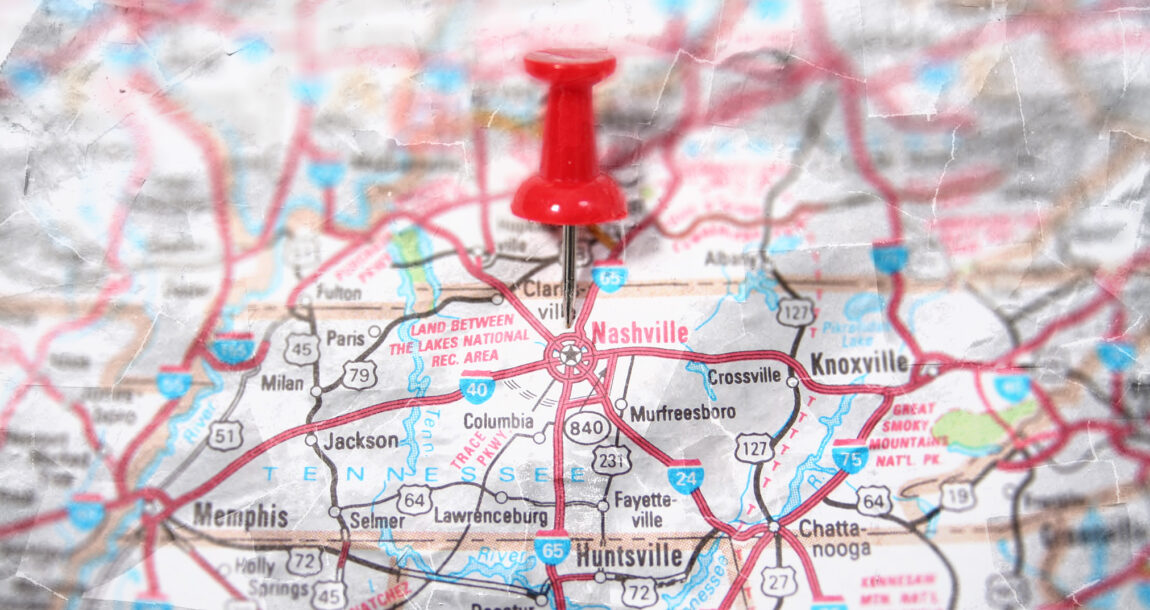 Image of a map with a pushpin stuck in the center of Tennessee.