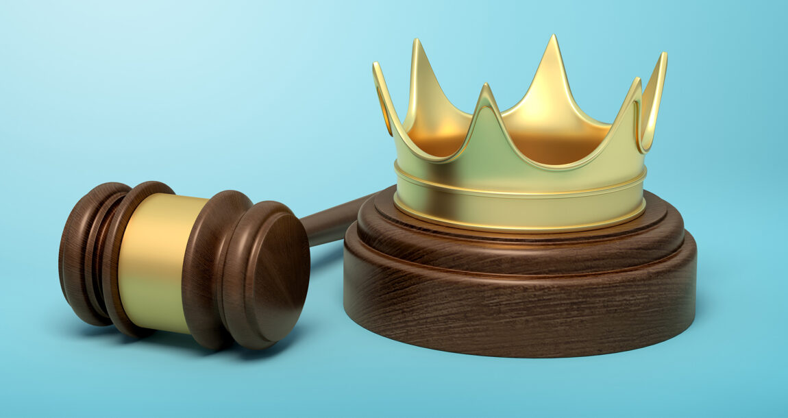 Picture show a judge's gavel and a crown