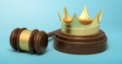 Picture show a judge's gavel and a crown