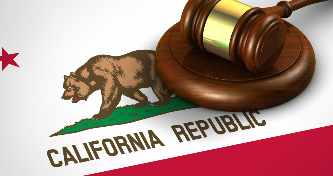 Image shows a judge's gavel over an old California flag design