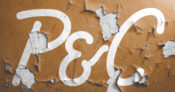Image shows the letters "P&C" against a paint-chipped wall.