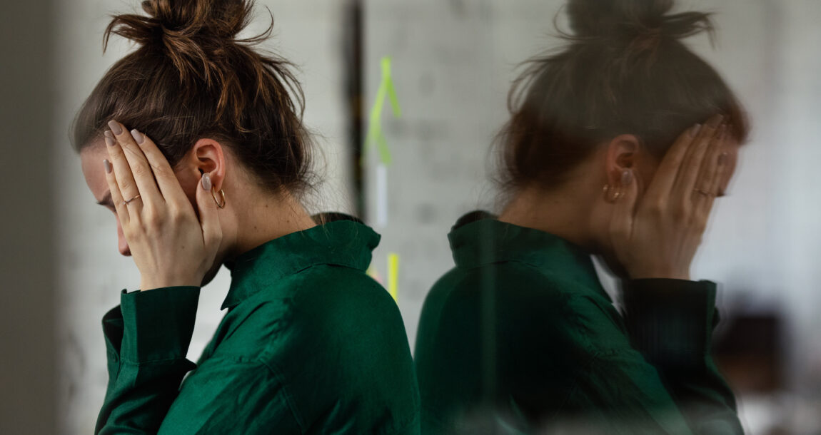 Young sad woman in office, having problem.