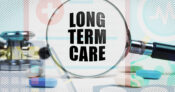 Image showing a magnifying glass through which can be seen the words "Long Term Care."