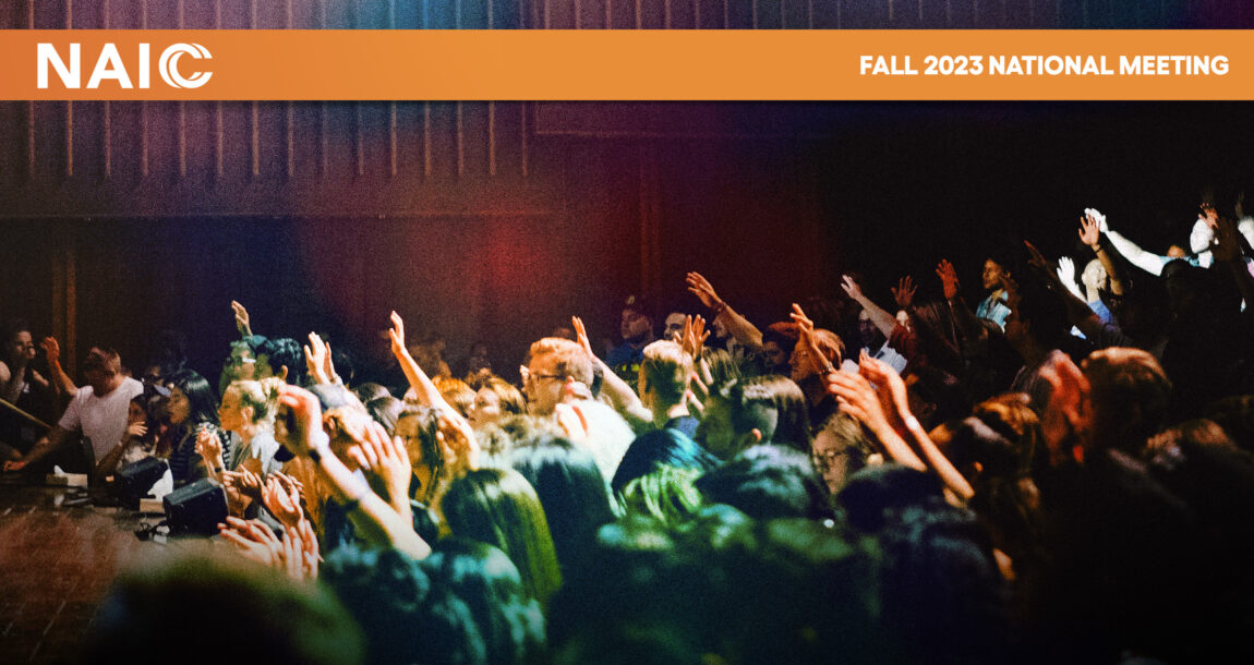 Image shows the NAIC logo over a photo of a crowd of people in an auditorium.