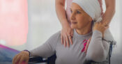 Image of young women in a wheelchair wearing a head scarf. Cancer-cases-are-skewing-younger--How-one-insurer-is-responding.