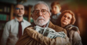 Image of an older man holding a bag of money while his family stands silently in the background. Many-Americans-have-no-plans-to-discuss-wealth-transfer-with-their-families.