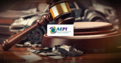 Image of a toy auto crushed under a judge's gavel with the logo for Automotive Education and Policy Institute (AEPI). P&C-insurers-using-consumer-laws-to-sue-service-providers,-says-AEPI.