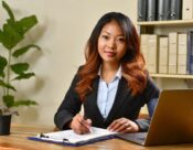 Image of a female financial services professional at work. Women share their challenges in the financial services industry.