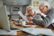 Elderly couple looking over their retirement finances. What's new for Secure 2.0 and workplace retirement.