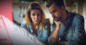 Image of couple looking concerned as they review financial documents. How-to-address-your-clients-annuity-concerns.