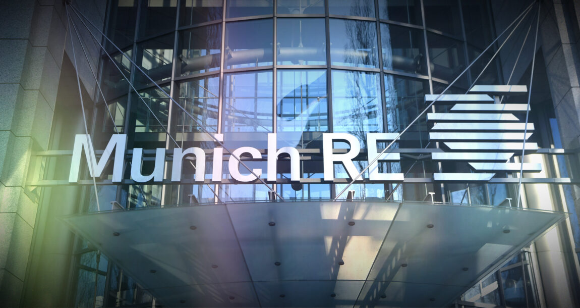 Image of Munich RE logo overlapping a modern office building. Munich-RE-says-EHRs-are-underutilized.