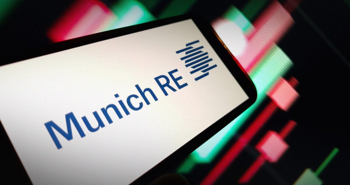 Image of Munich RE logo overlapping a modern office building. Munich-RE-says-EHRs-are-underutilized.