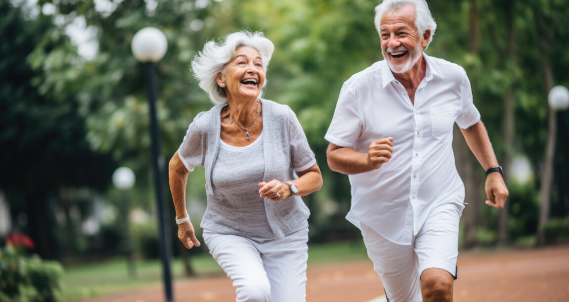 Photo of senior couple running along a track. John Hancock expands its longevity arsenal.