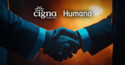 Image of two business people shaking hands with the Cigna and Humana logos overlaying. Cigna-and-Humana-reportedly-seeking-a-second-chance-at-deal.