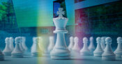 An illustration of chess pieces on a chessboard, with the IBM logo in the background. Is-there-a-winning-AI-strategy-for-insurers-IBM-says-yes