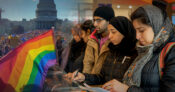 Image of a diverse crowd of people standing in front of the Capitol building in Washington, D.C.