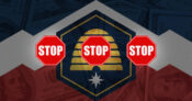 Image shows three stop signs.