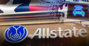 Image shows the Texas state flag and the Allstate logo.