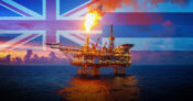 Image of an oil rig with the Hawaiin flag in the background. Hawaii-resolution-targets-oil-gas-cos-to-recoup-rising-insurance-costs.