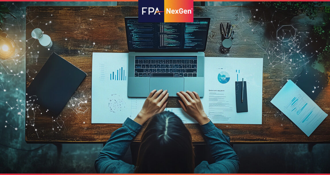 Image shows an overhead shot of a woman at a desk with a laptop.