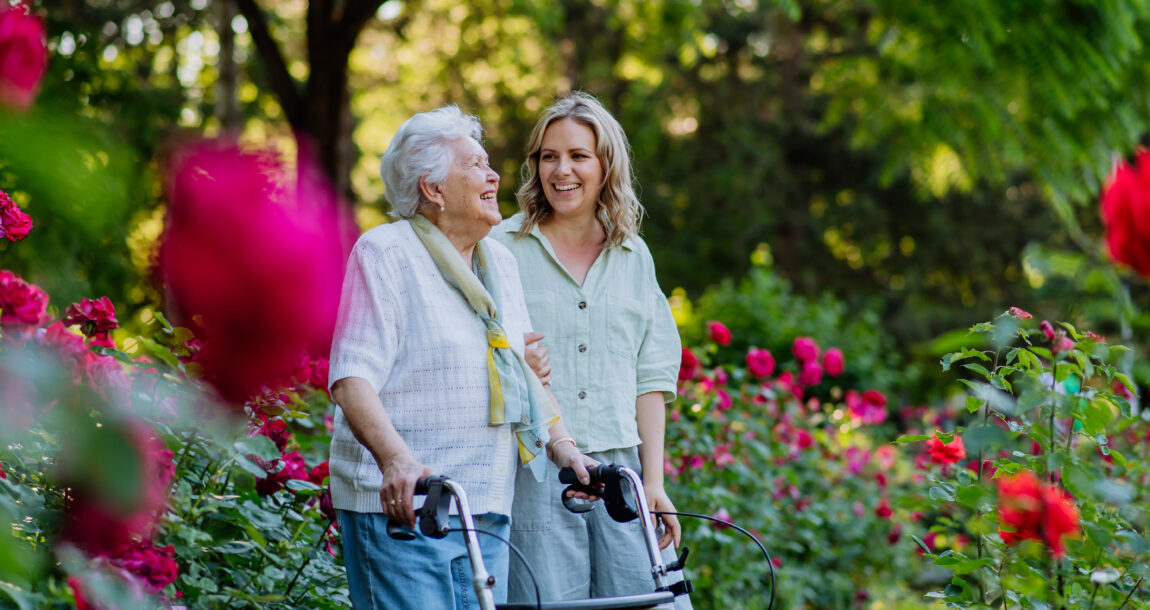 Image of a senior citizen with her family caregiver. How LTCi impacts the family caregivers of Alzheimer's victims.