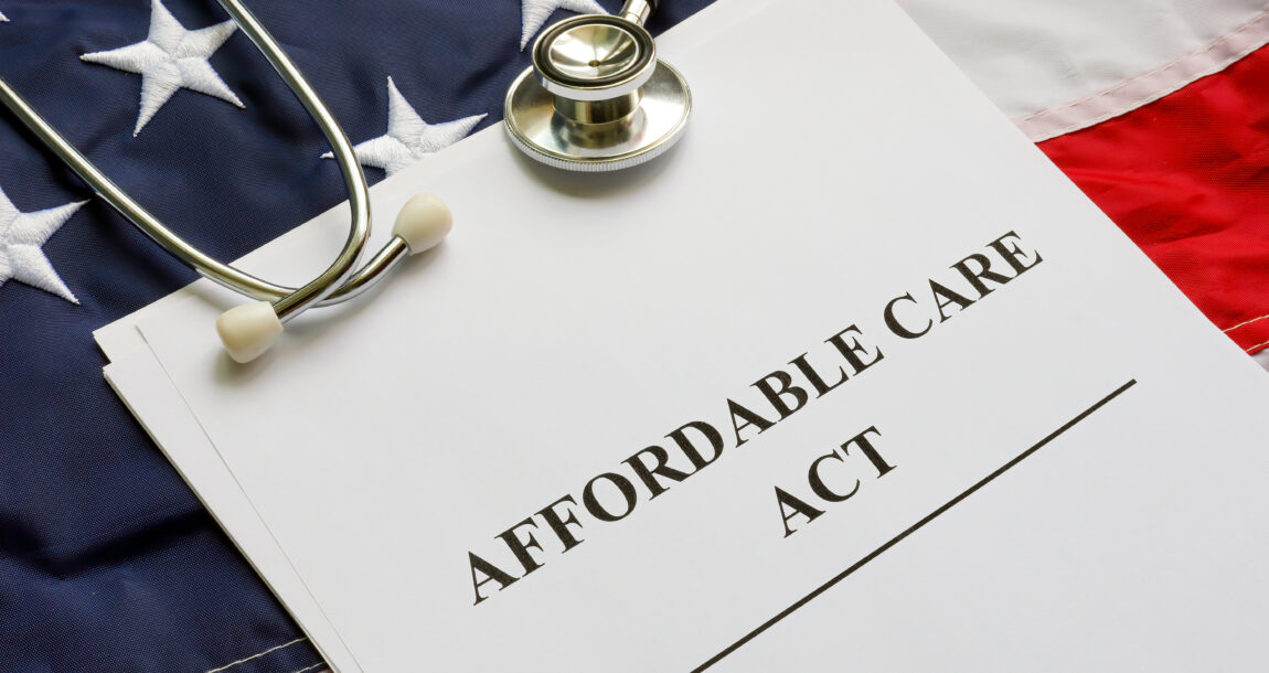 Image showing "Affordable Care Act" folder lying on an American flag, along with a stethescope. House passes bill to extend enhanced ACA subsidies 3 years.