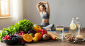 Photo of woman practicing yoga while there is health food in the foreground.