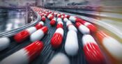 Image shows a conveyer belt of pills