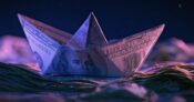 Image shows a paper boat