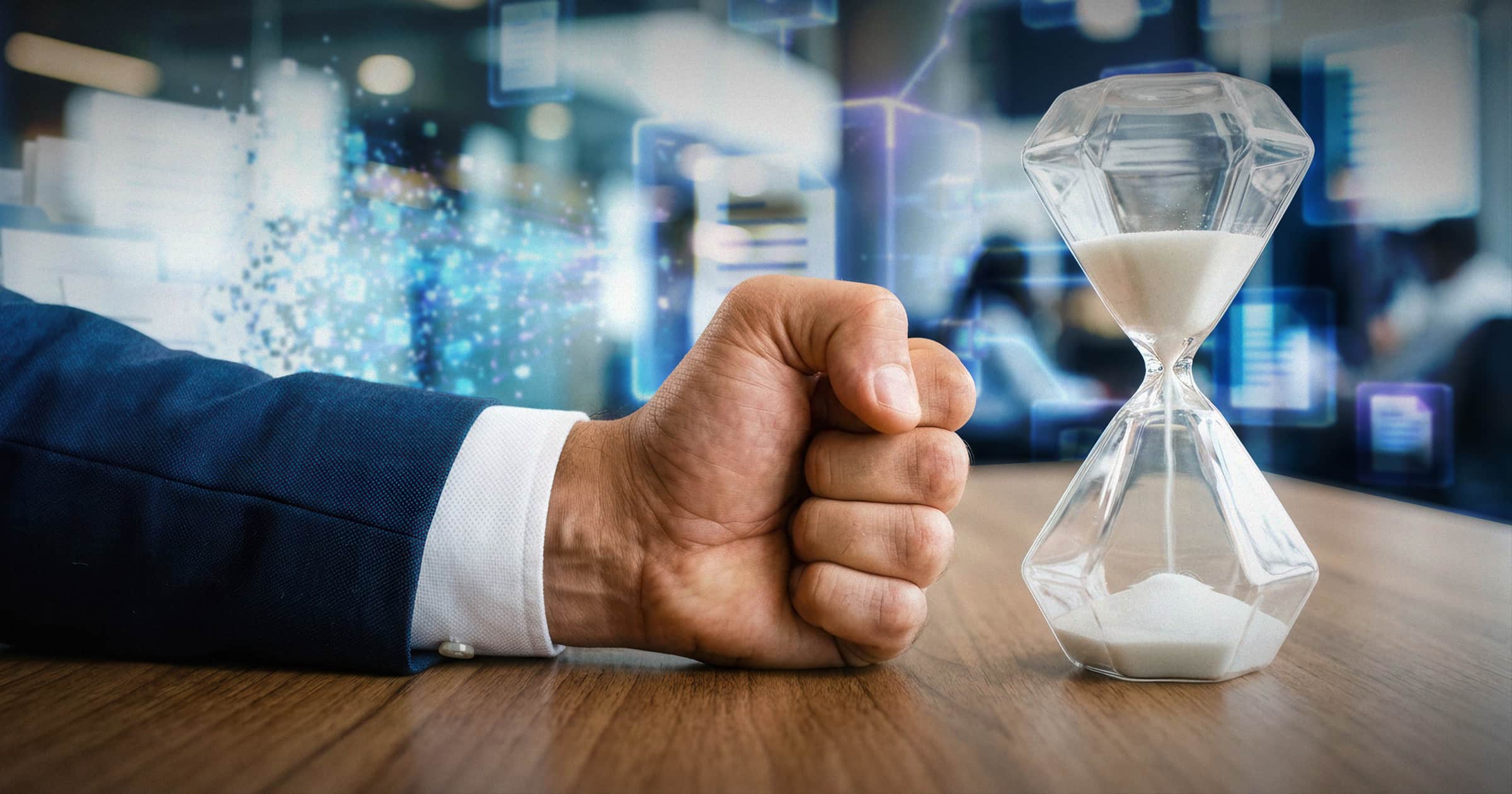 Image shows a man's fist and an hourglass filled with sand